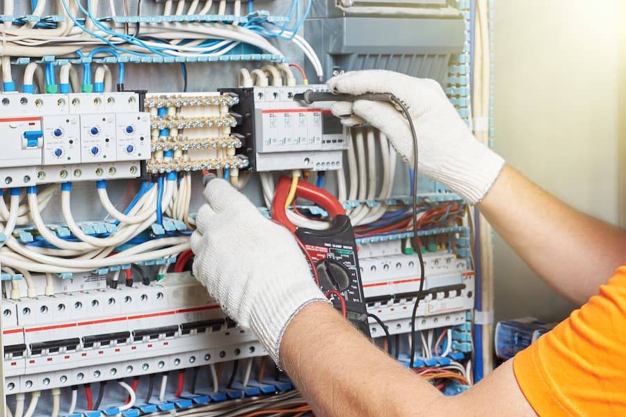 electrical engineer working in a power electrical panel